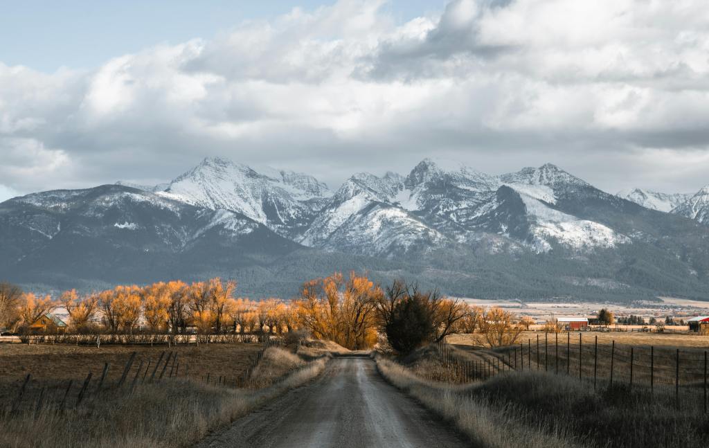 Discover the breathtaking autumn landscape with snow-capped mountains in Montana, USA.